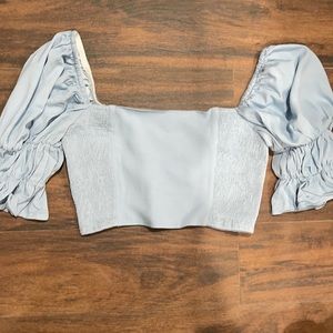 Light blue ruffled sleeve crop top. Size medium.